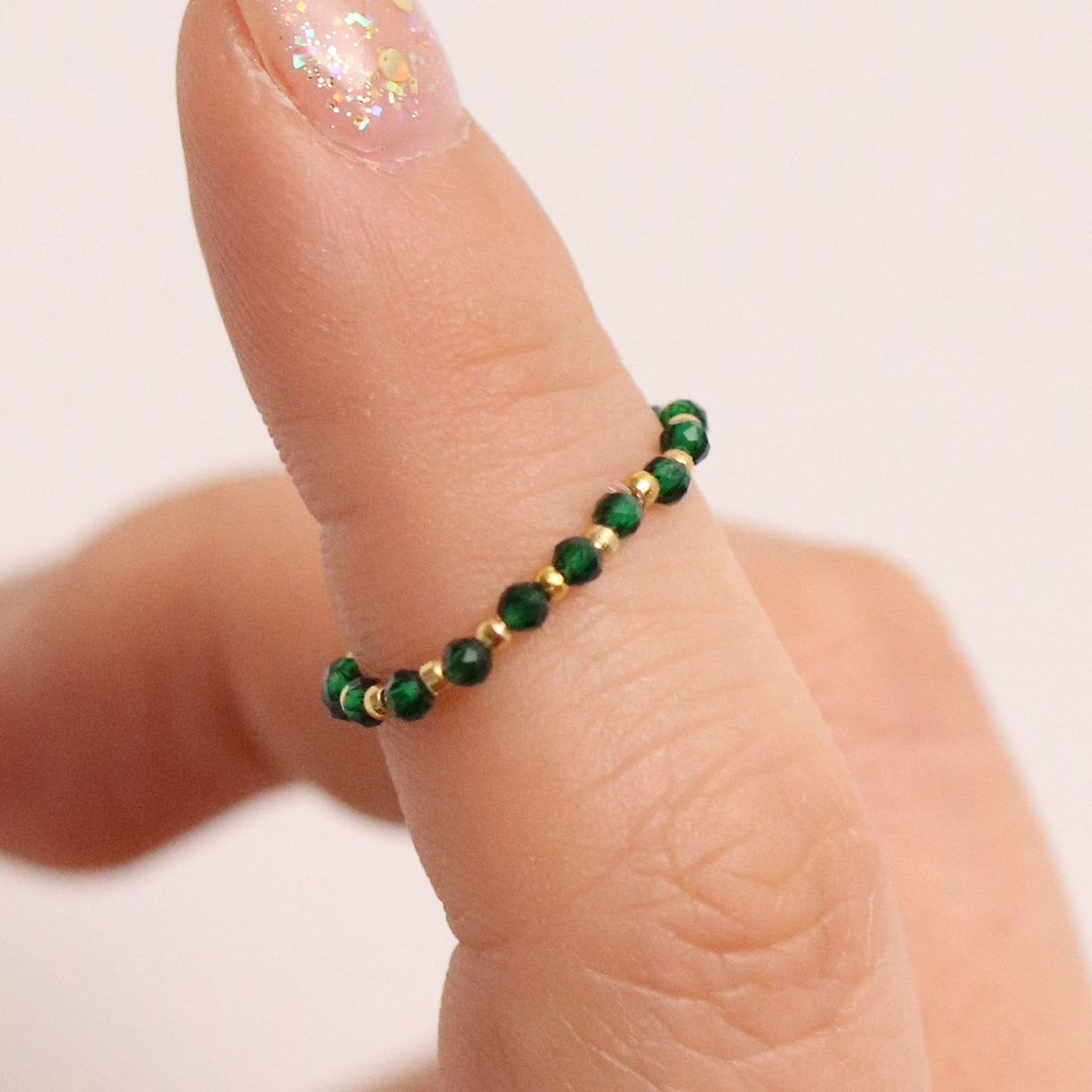 Stretchy Gemstone Ring featuring semi-precious gemstones and delicate sterling silver plated beads, offering a comfortable fit with a touch of refined elegance.