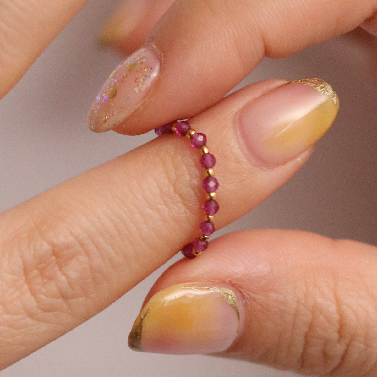 Stretchy Gemstone Ring featuring semi-precious gemstones and delicate sterling silver plated beads, offering a comfortable fit with a touch of refined elegance.