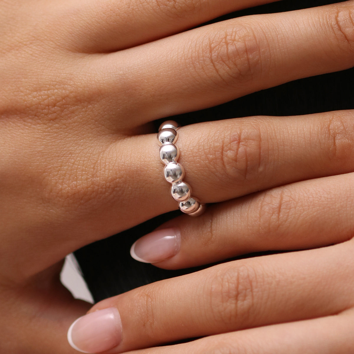 Bubble Ring made from 925 sterling silver, featuring a playful bubble design with polished circles, handmade in London for a modern, elegant touch.