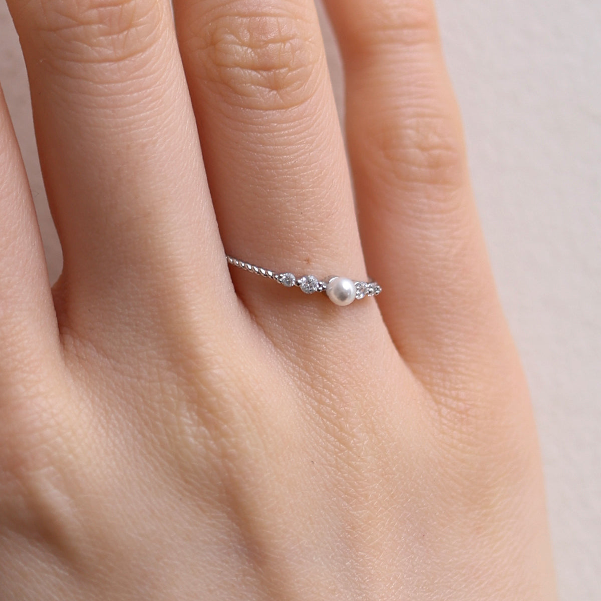 Pearl Cubic Ring featuring high-quality freshwater pearls in a unique cubic design, offering timeless elegance and sophisticated style for any occasion.