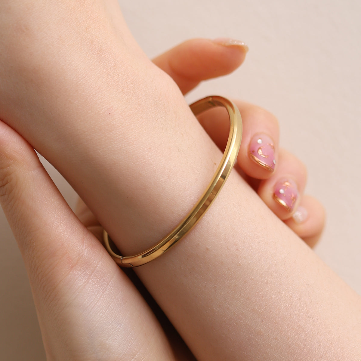 Thin Bangle featuring a precision-crafted, minimalist design with a slender profile, offering versatile style and durable elegance for any occasion.