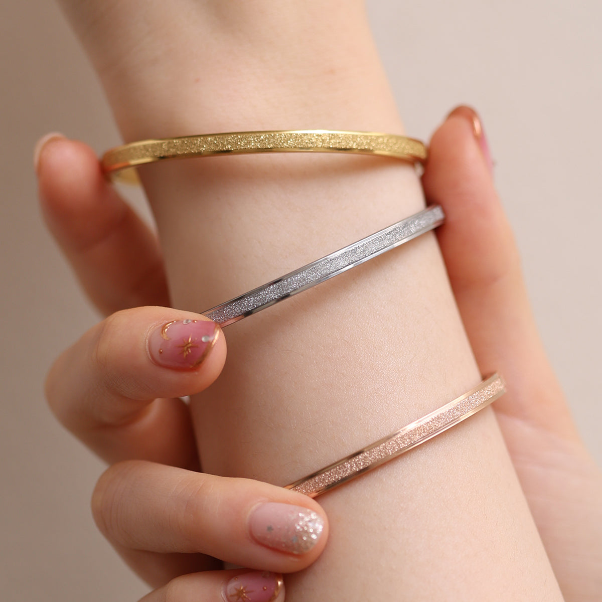Delicate Thin Glitter Bangle featuring a subtle glitter finish for a touch of sparkle, crafted for minimalist elegance and all-day comfort—perfect worn alone or stacked.