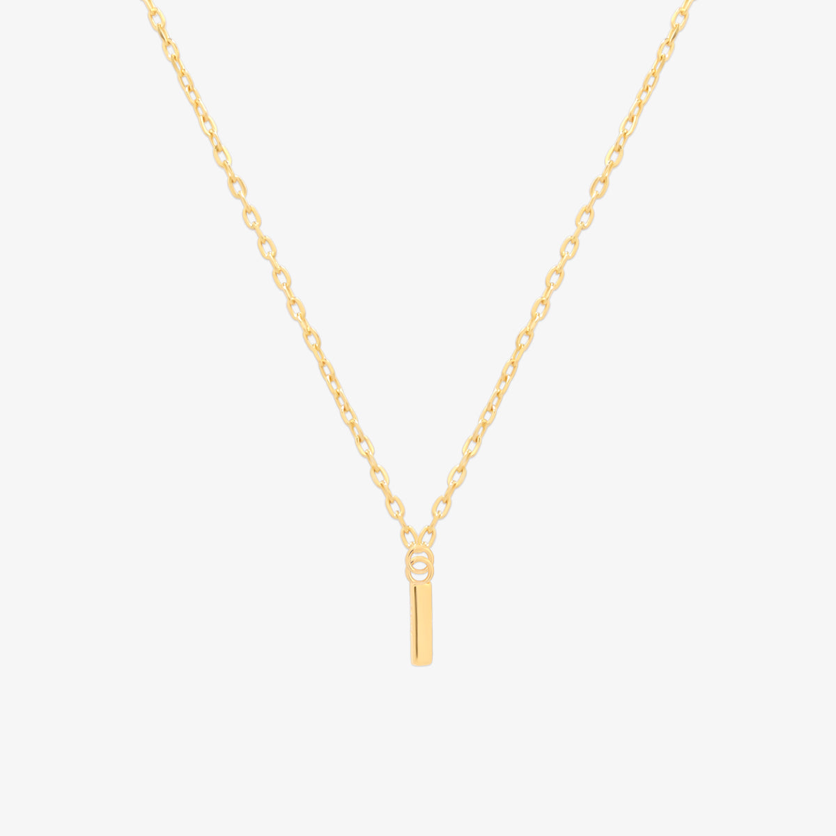 Classic initial pendant necklace featuring a polished letter charm on a delicate chain, showcasing a timeless and elegant design.