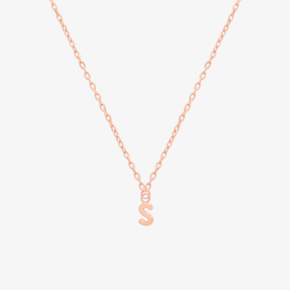 Classic initial pendant necklace featuring a polished letter charm on a delicate chain, showcasing a timeless and elegant design.