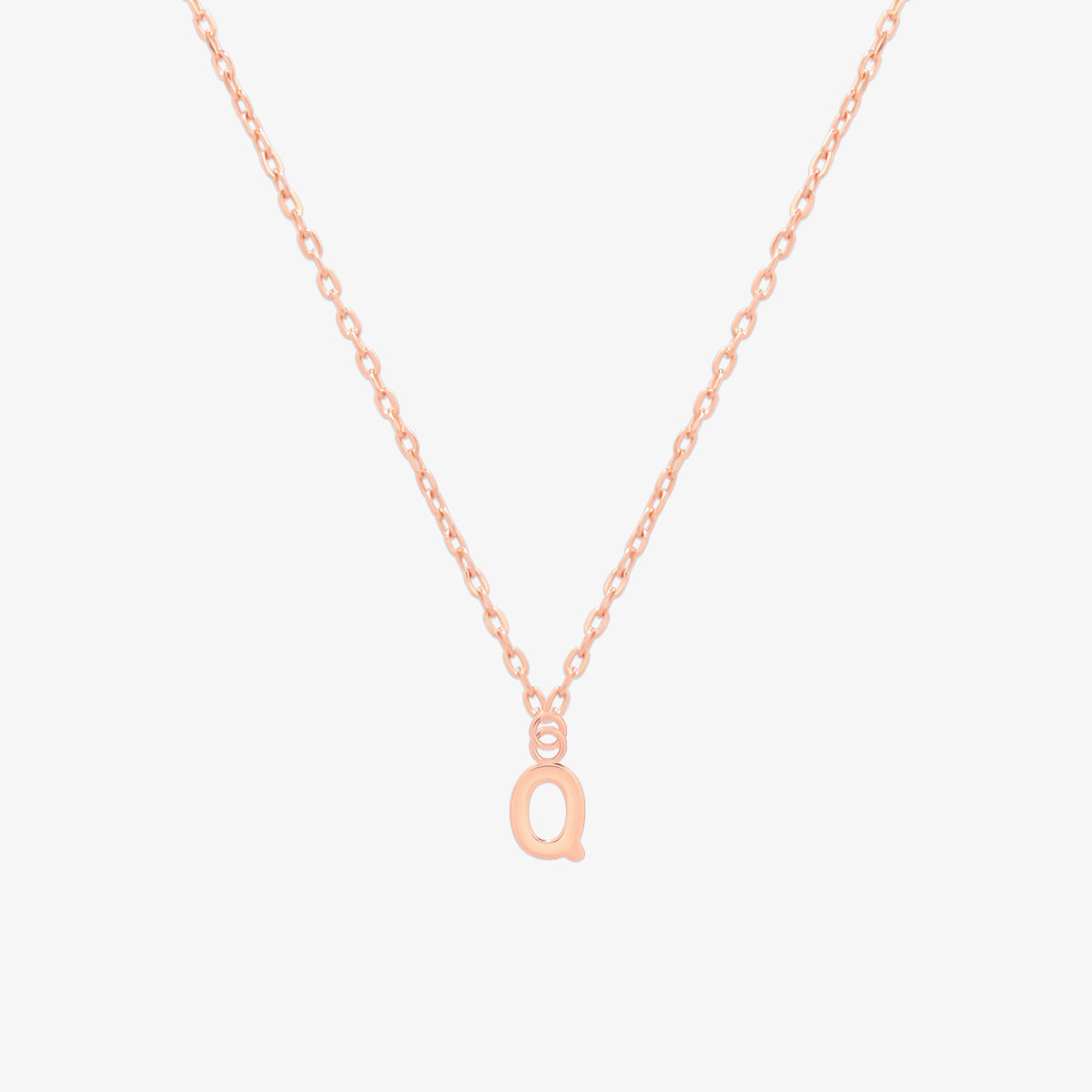 Classic initial pendant necklace featuring a polished letter charm on a delicate chain, showcasing a timeless and elegant design.