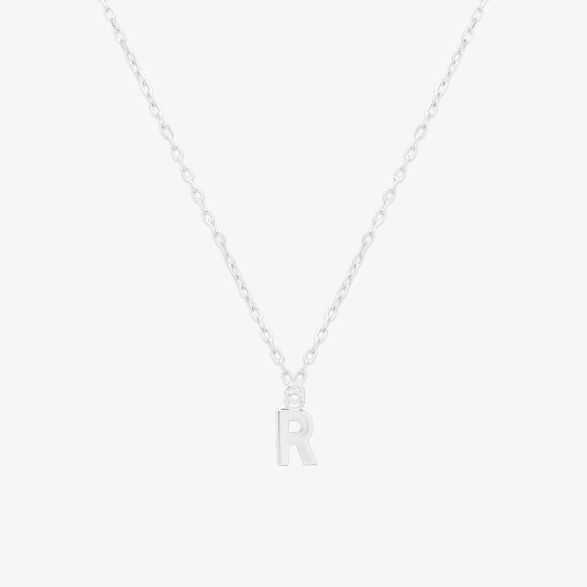 Classic initial pendant necklace featuring a polished letter charm on a delicate chain, showcasing a timeless and elegant design.