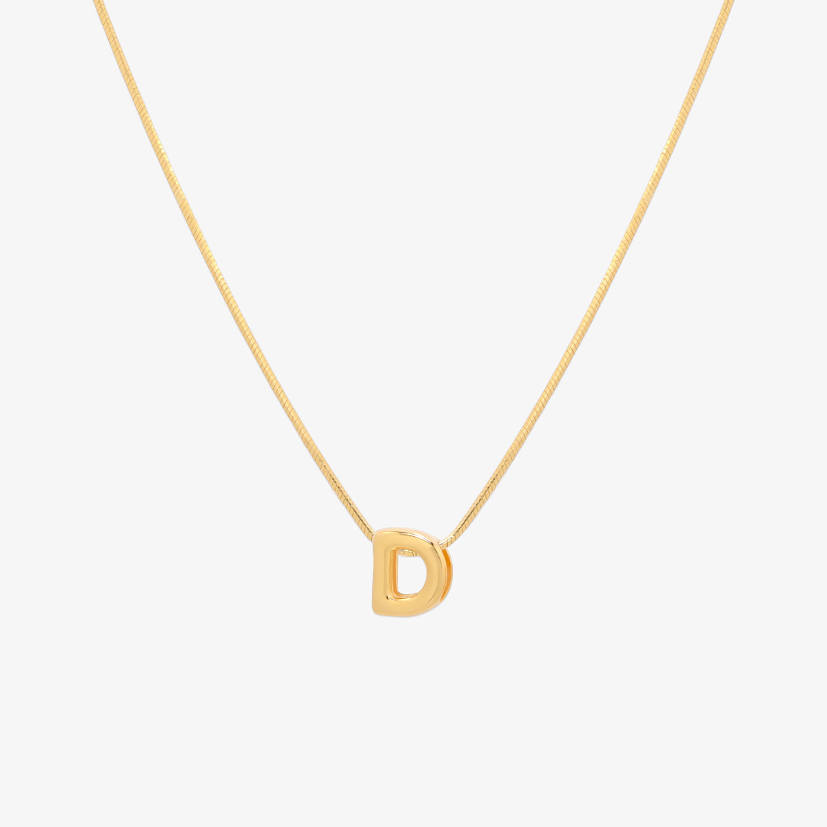 Bubble initial pendant necklace featuring a rounded, playful letter charm on a sleek snake chain, with a smooth and glossy finish.