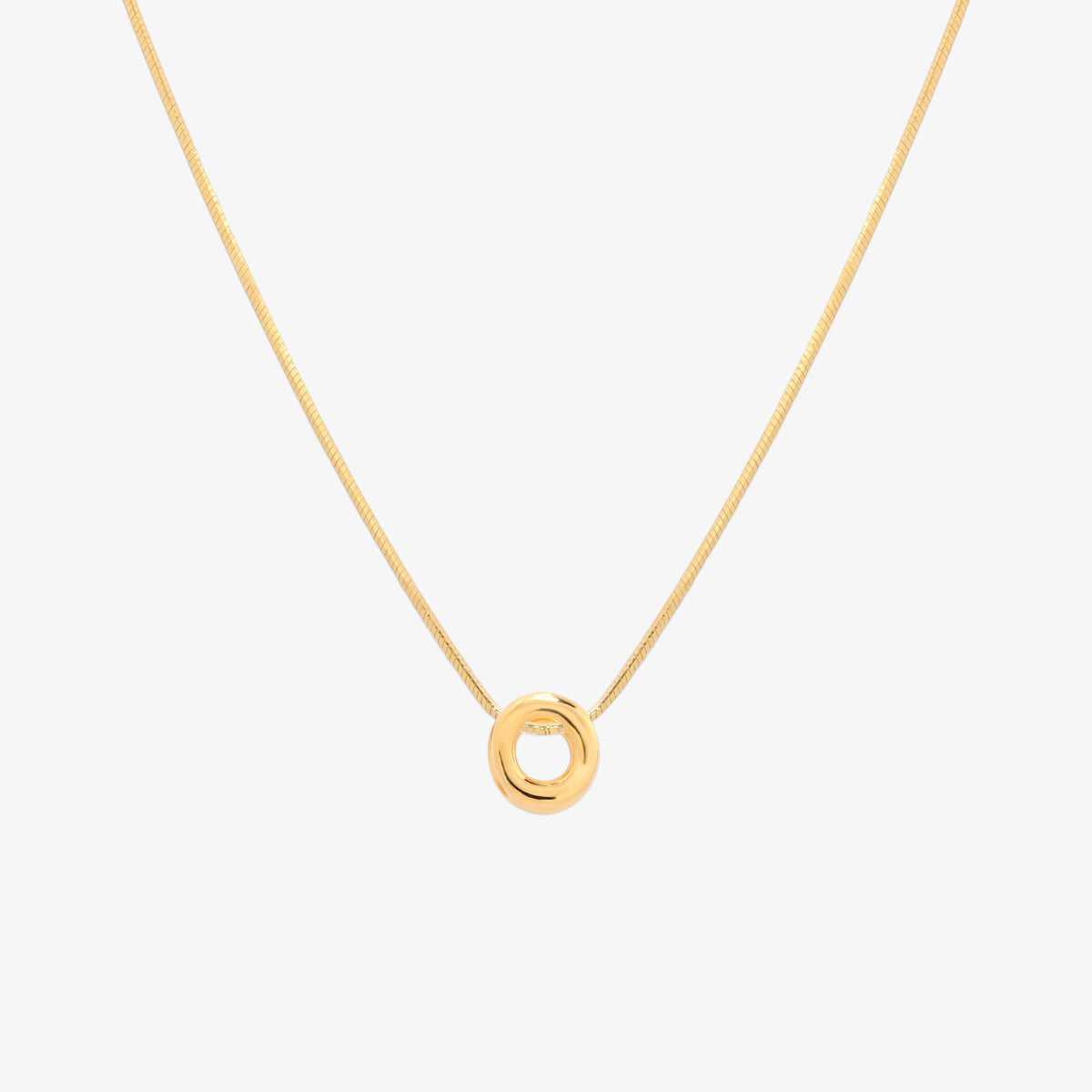 Bubble initial pendant necklace featuring a rounded, playful letter charm on a sleek snake chain, with a smooth and glossy finish.