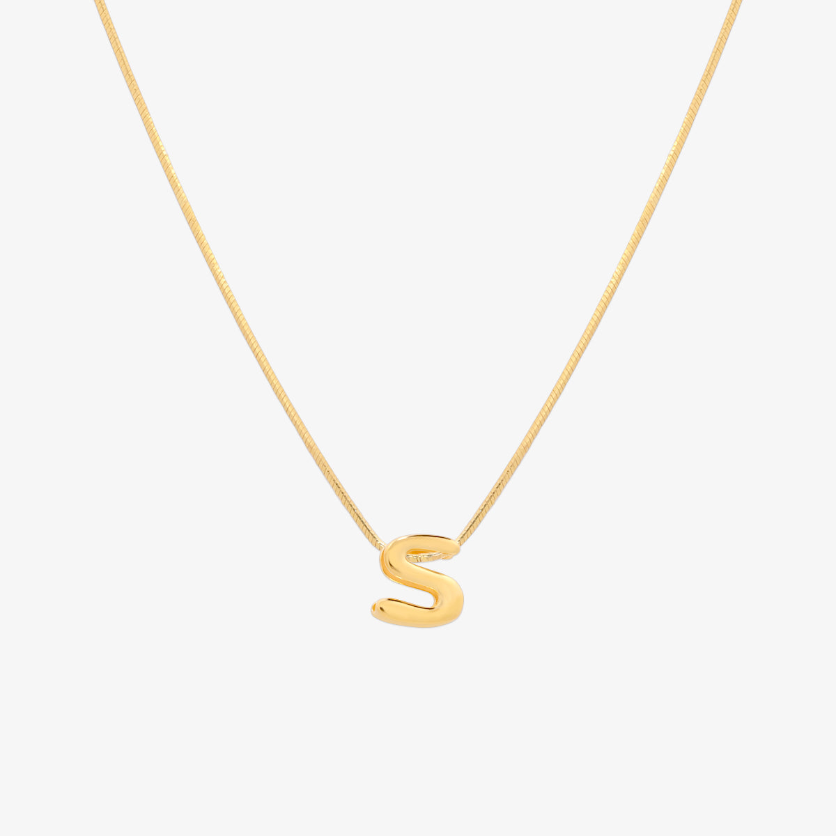 Bubble initial pendant necklace featuring a rounded, playful letter charm on a sleek snake chain, with a smooth and glossy finish.