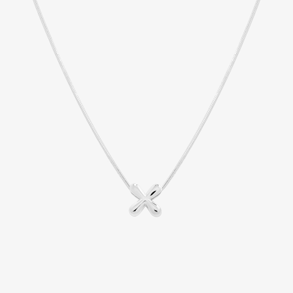 Bubble initial pendant necklace featuring a rounded, playful letter charm on a sleek snake chain, with a smooth and glossy finish.