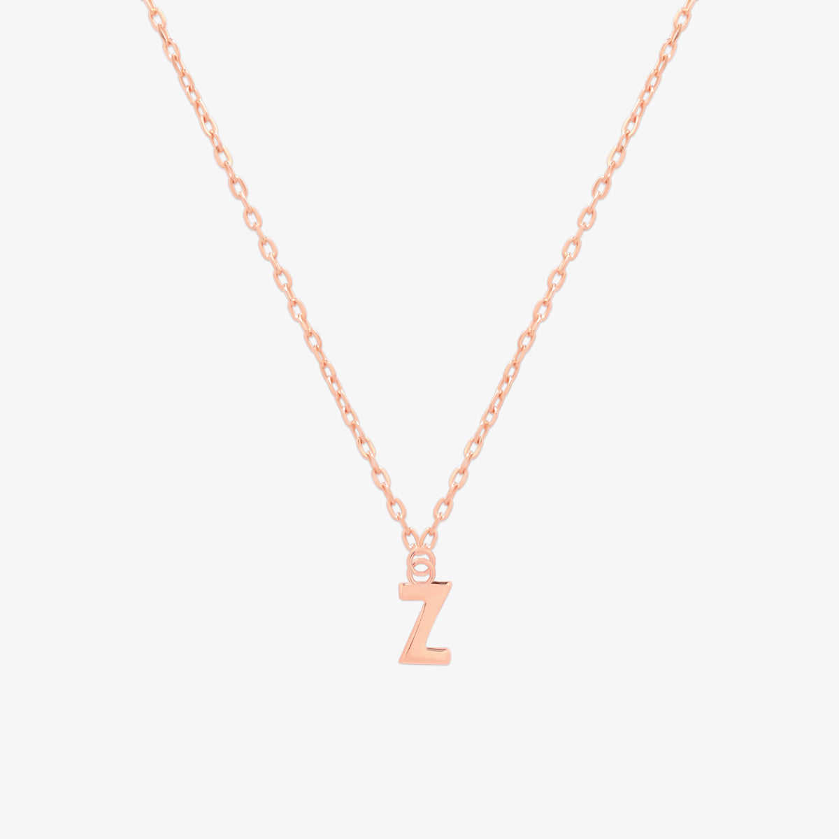 Classic initial pendant necklace featuring a polished letter charm on a delicate chain, showcasing a timeless and elegant design.