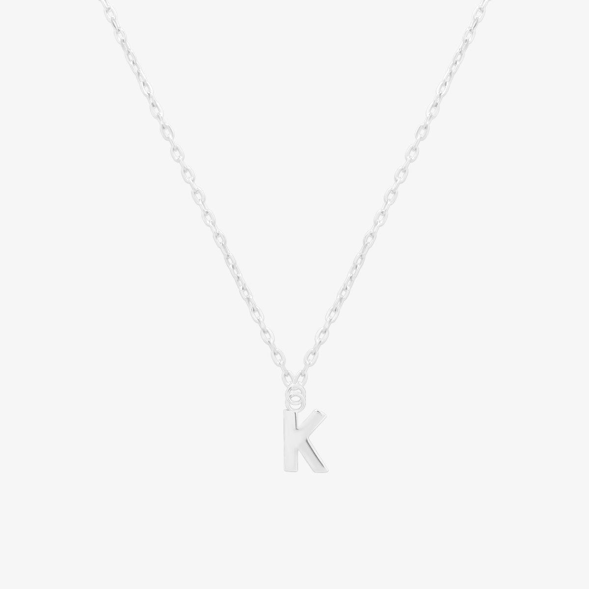 Classic initial pendant necklace featuring a polished letter charm on a delicate chain, showcasing a timeless and elegant design.