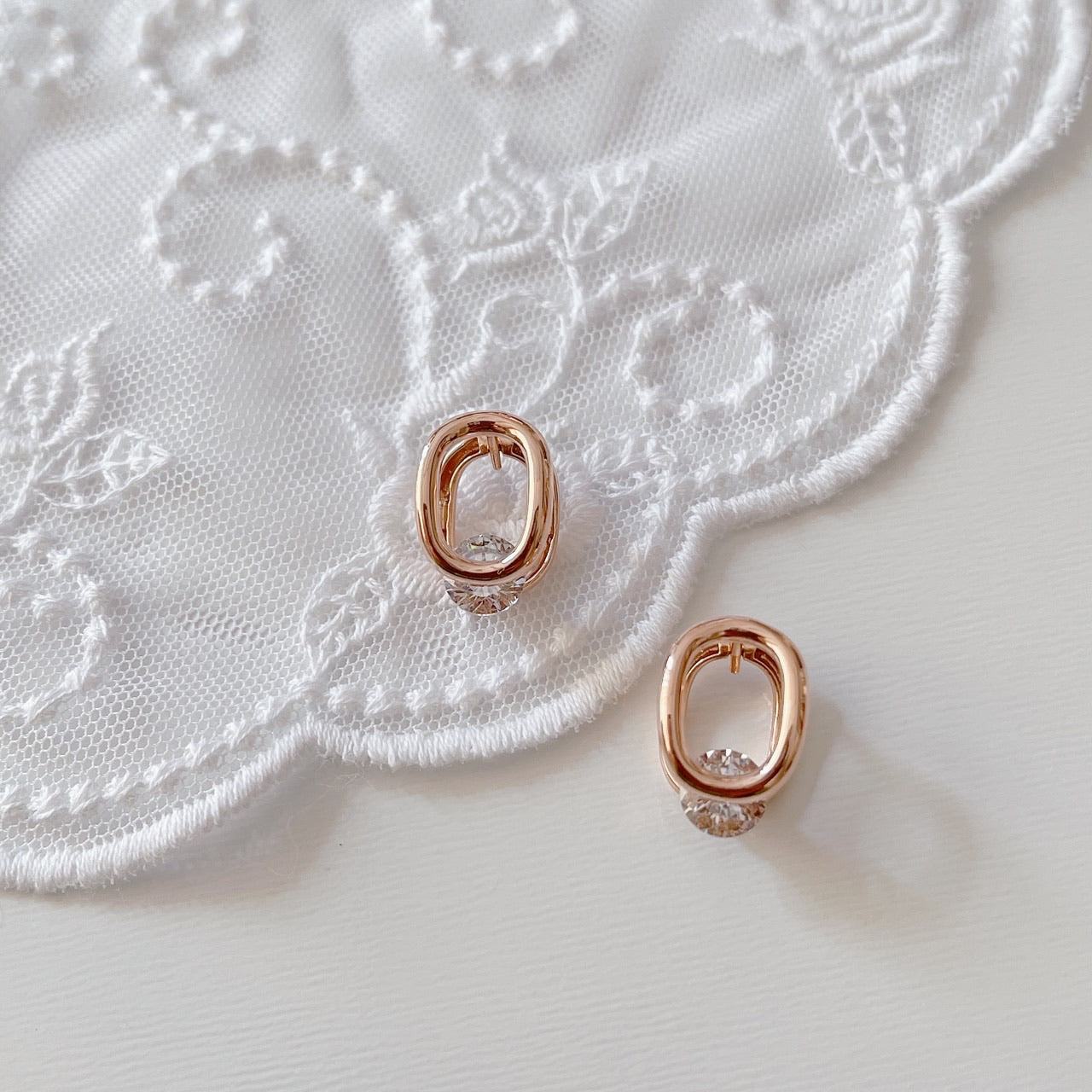 Cubic oval huggie earrings