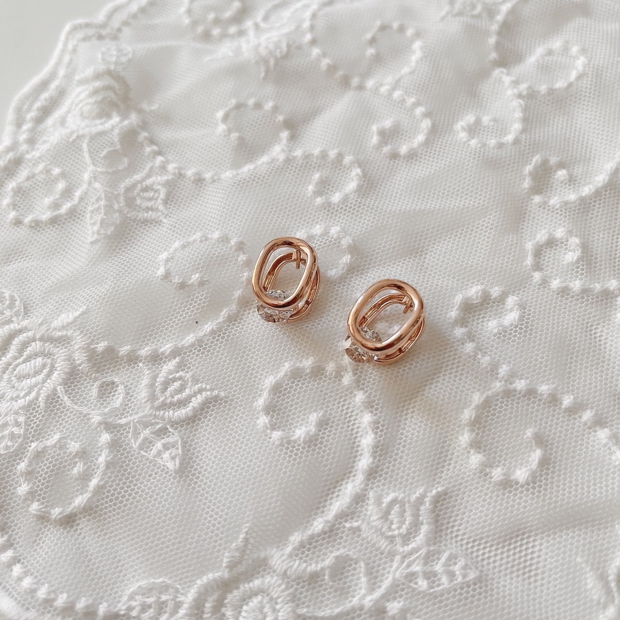 Cubic oval huggie earrings