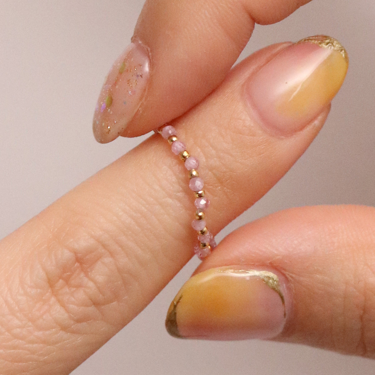 Stretchy Gemstone Ring featuring semi-precious gemstones and delicate sterling silver plated beads, offering a comfortable fit with a touch of refined elegance.