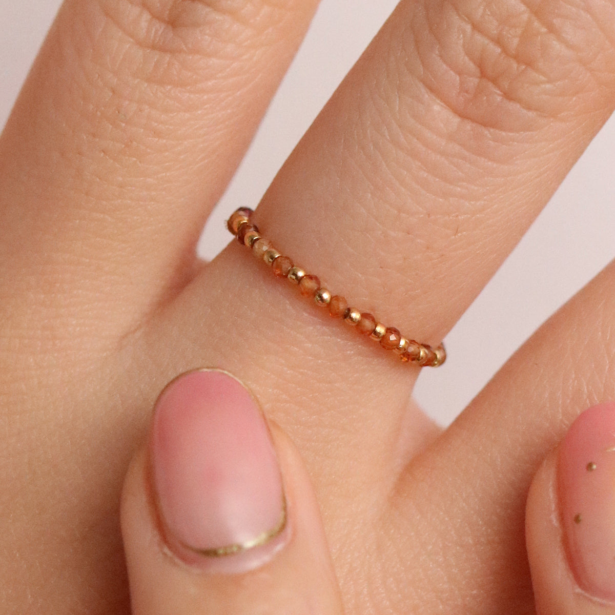 Stretchy Gemstone Ring featuring semi-precious gemstones and delicate sterling silver plated beads, offering a comfortable fit with a touch of refined elegance.