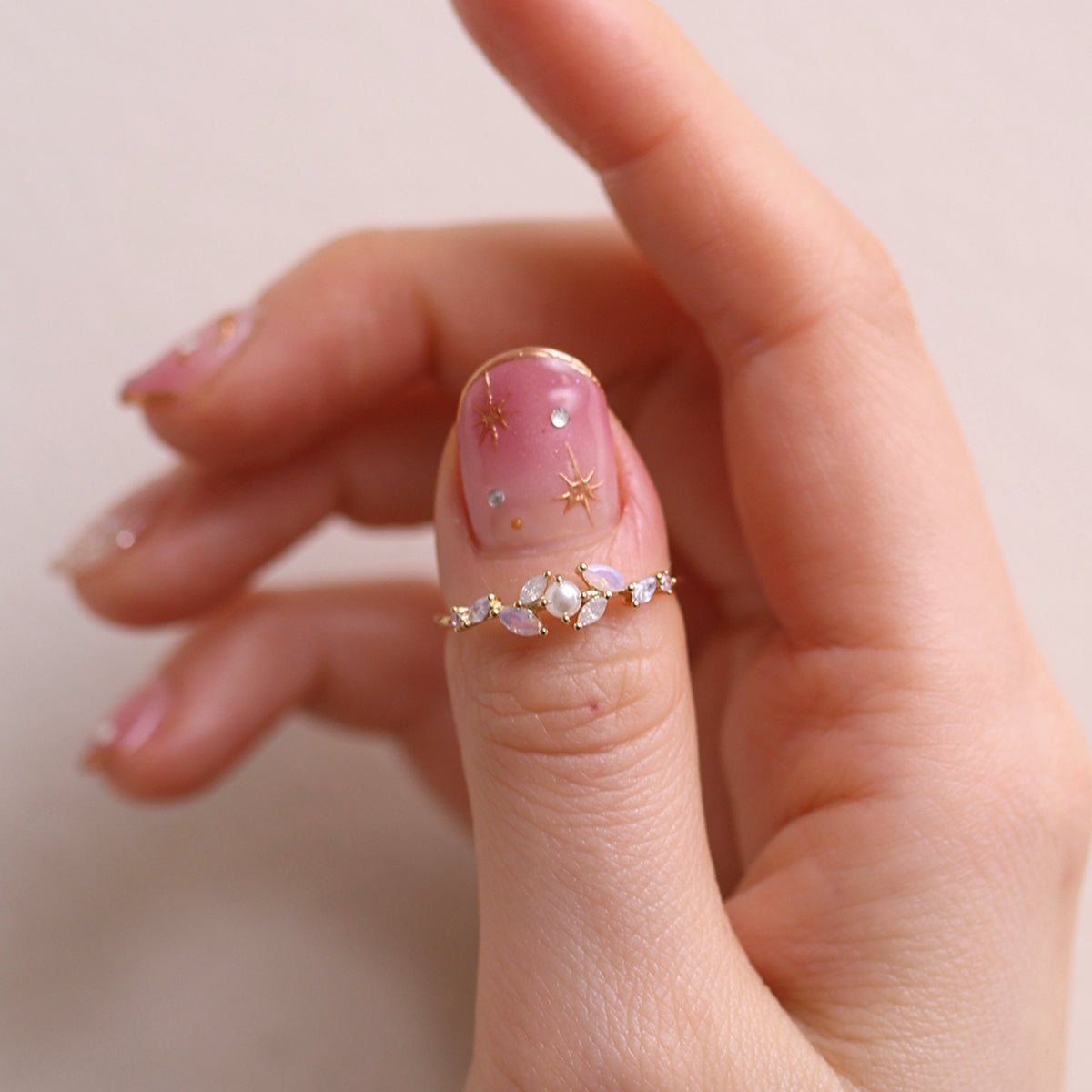 Moonstone Cubic Pearl Vine Ring featuring a delicate vine design with shimmering moonstone and lustrous cubic pearls, crafted for timeless elegance and sophistication.