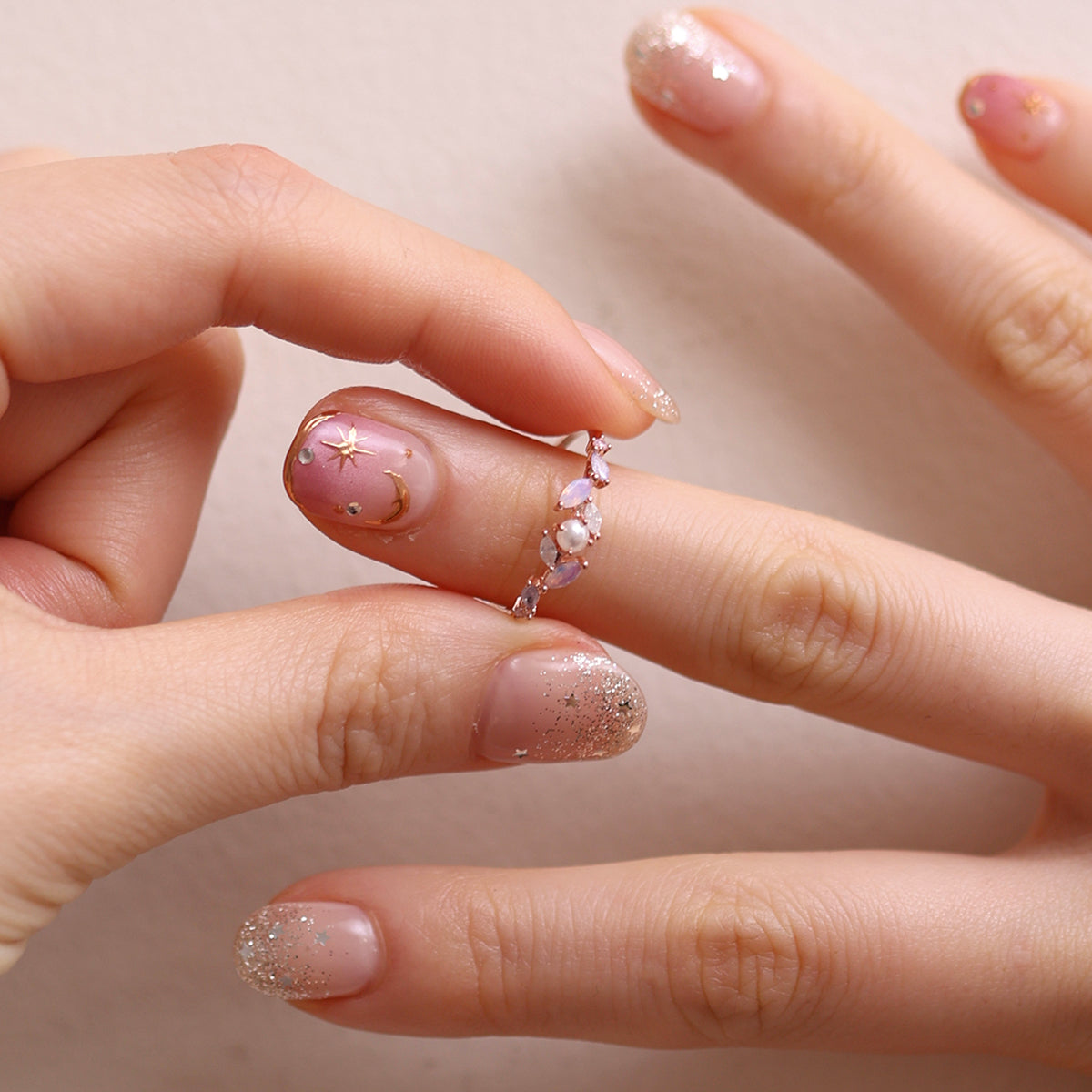 Moonstone Cubic Pearl Vine Ring featuring a delicate vine design with shimmering moonstone and lustrous cubic pearls, crafted for timeless elegance and sophistication.