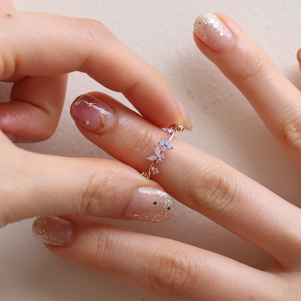 Butterfly Moonstone Flower Cubic Ring with a unique twist design and adjustable fit, combining layered elegance and modern style for any occasion.