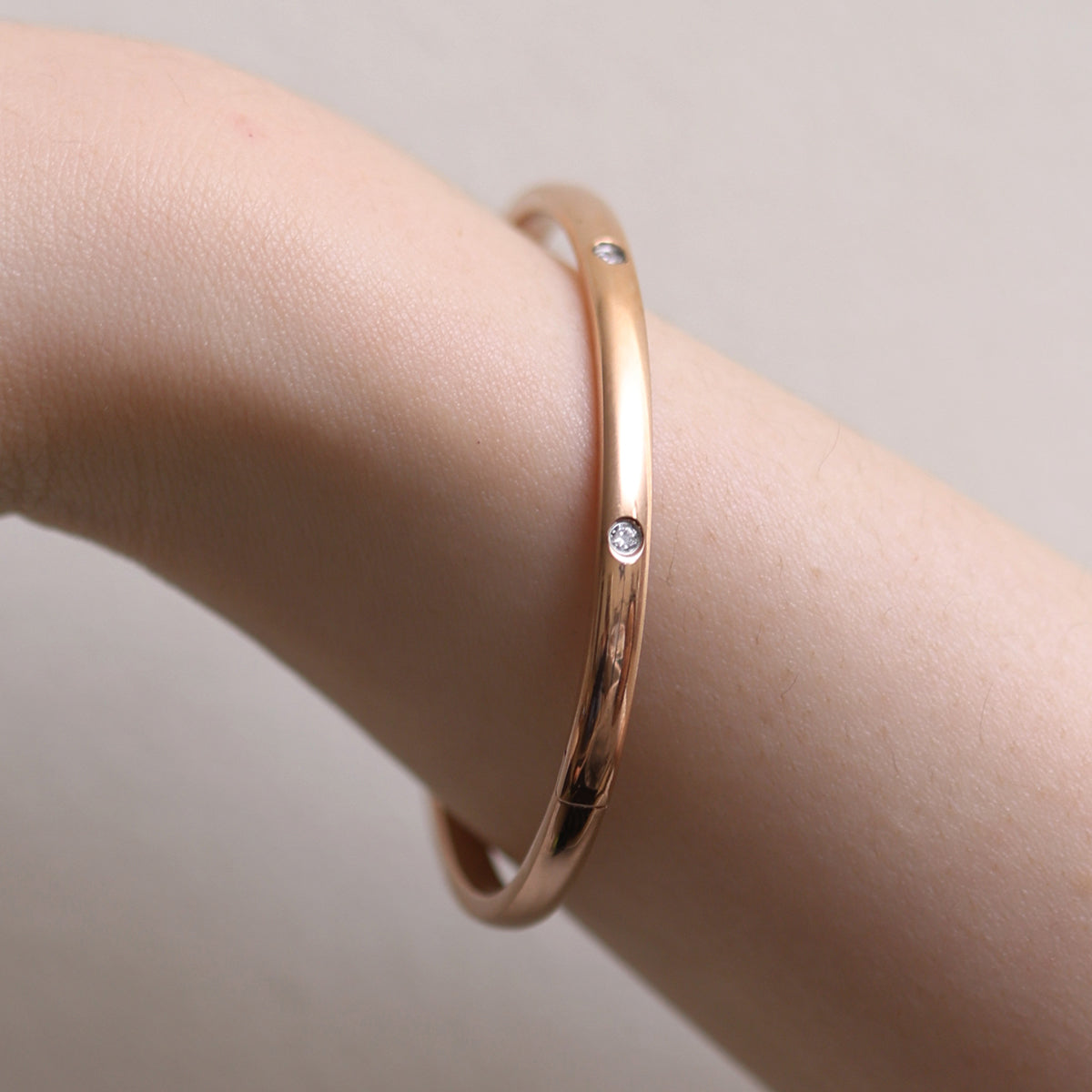 Thin Cubic Bangle precision-crafted with cubic design elements, offering a minimalist aesthetic, lightweight comfort, and versatile elegance for standalone wear or stylish layering.