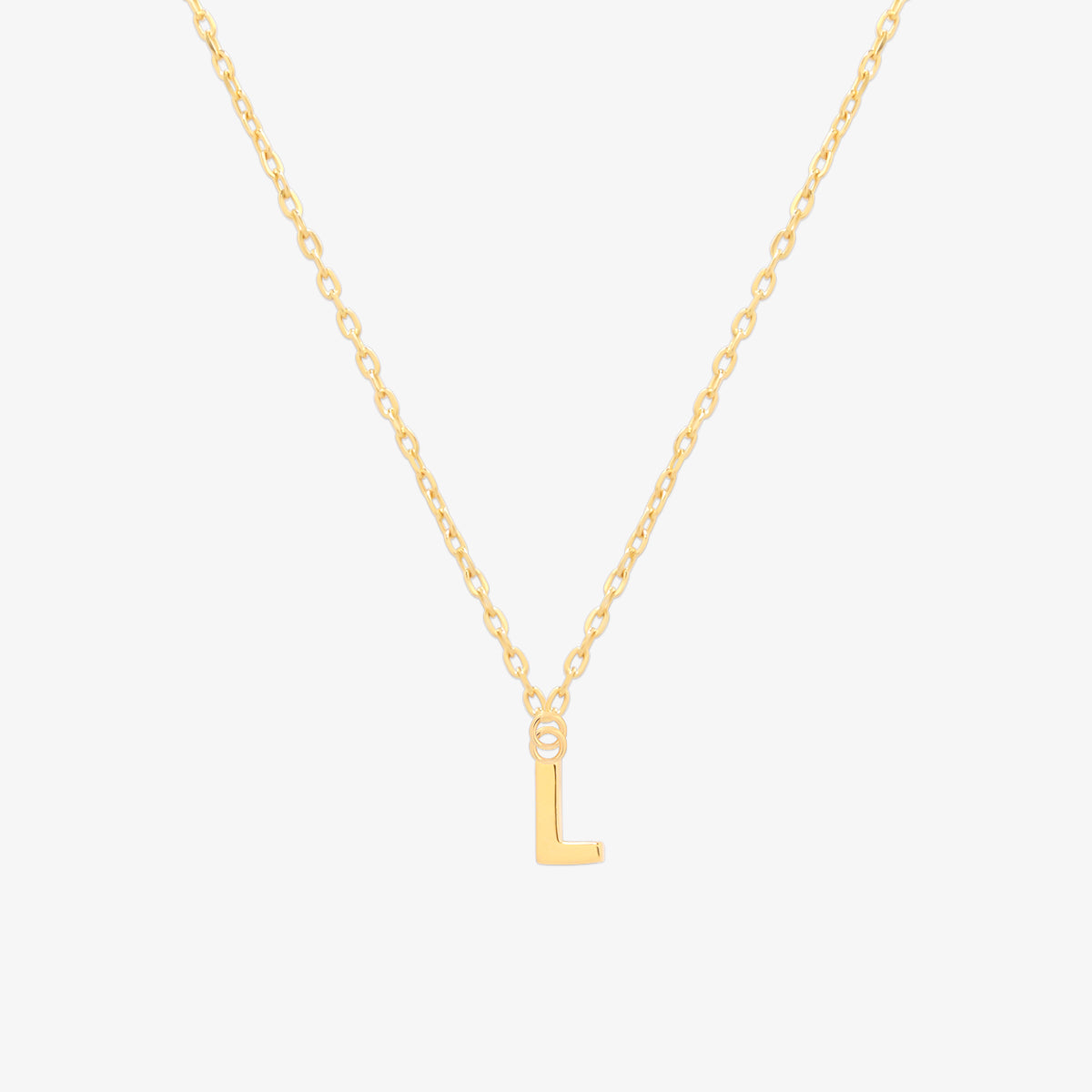 Classic initial pendant necklace featuring a polished letter charm on a delicate chain, showcasing a timeless and elegant design.