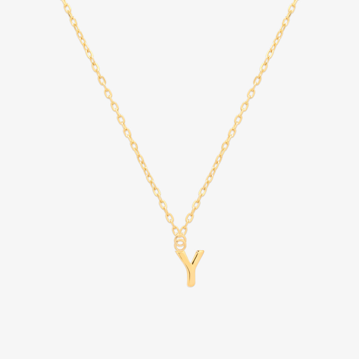 Classic initial pendant necklace featuring a polished letter charm on a delicate chain, showcasing a timeless and elegant design.