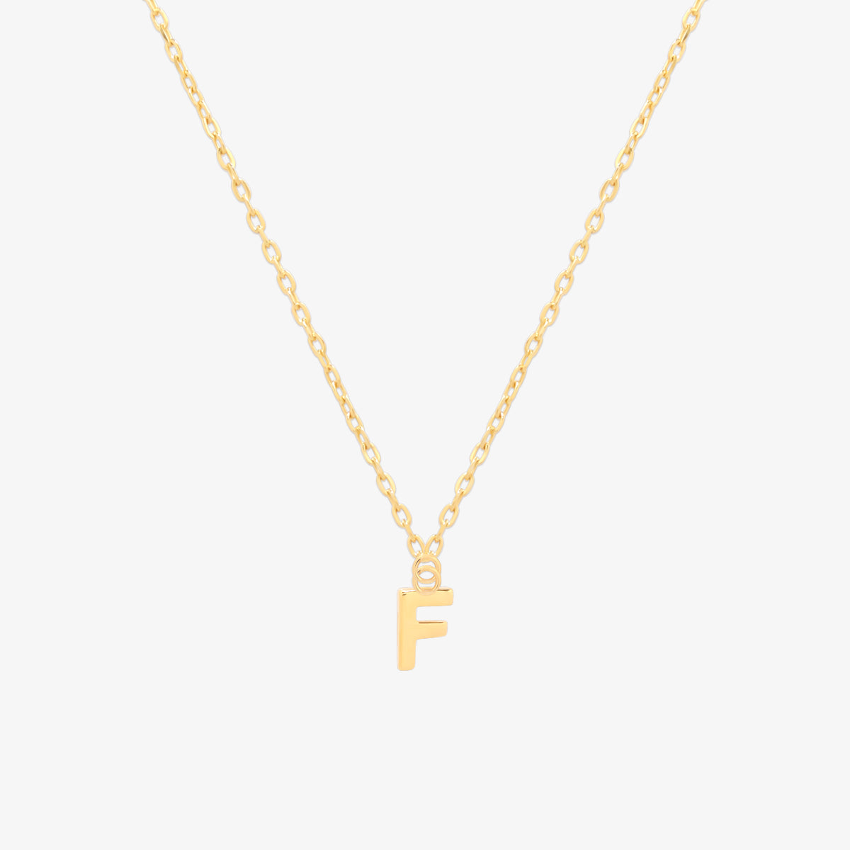 Classic initial pendant necklace featuring a polished letter charm on a delicate chain, showcasing a timeless and elegant design.