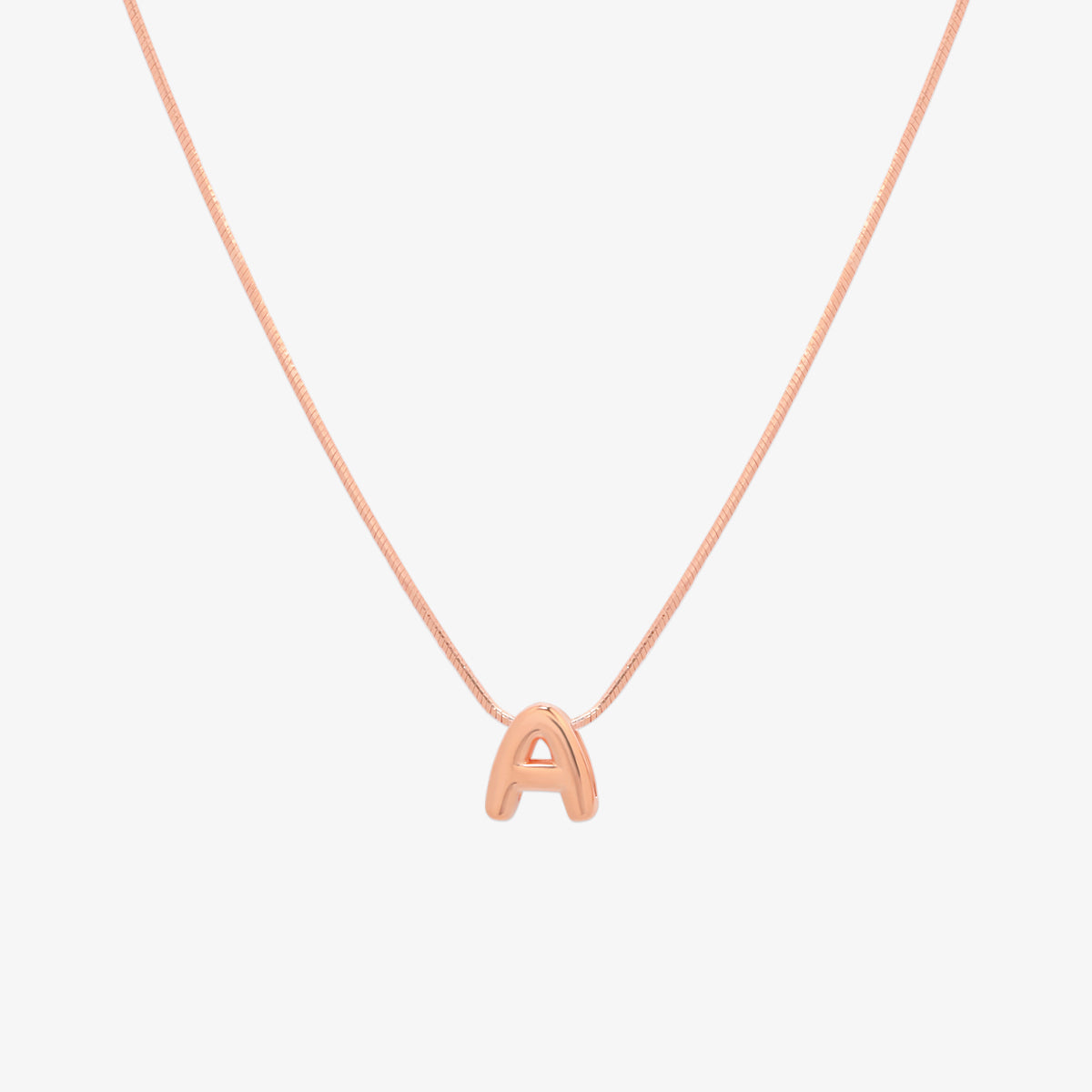 Bubble initial pendant necklace featuring a rounded, playful letter charm on a sleek snake chain, with a smooth and glossy finish.