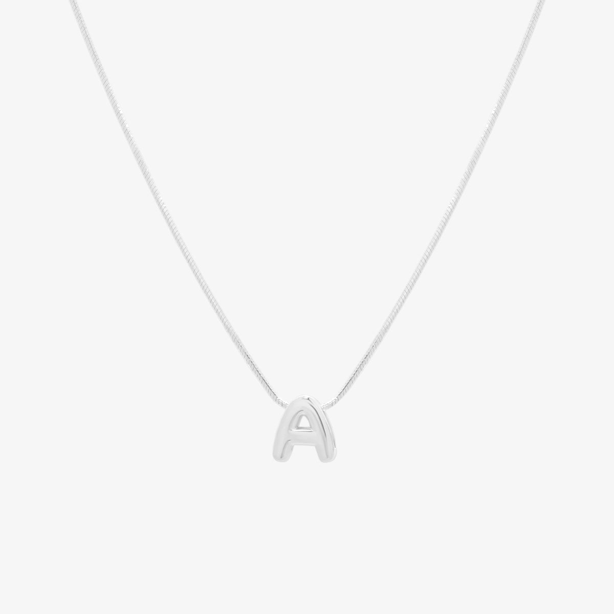 Bubble initial pendant necklace featuring a rounded, playful letter charm on a sleek snake chain, with a smooth and glossy finish.