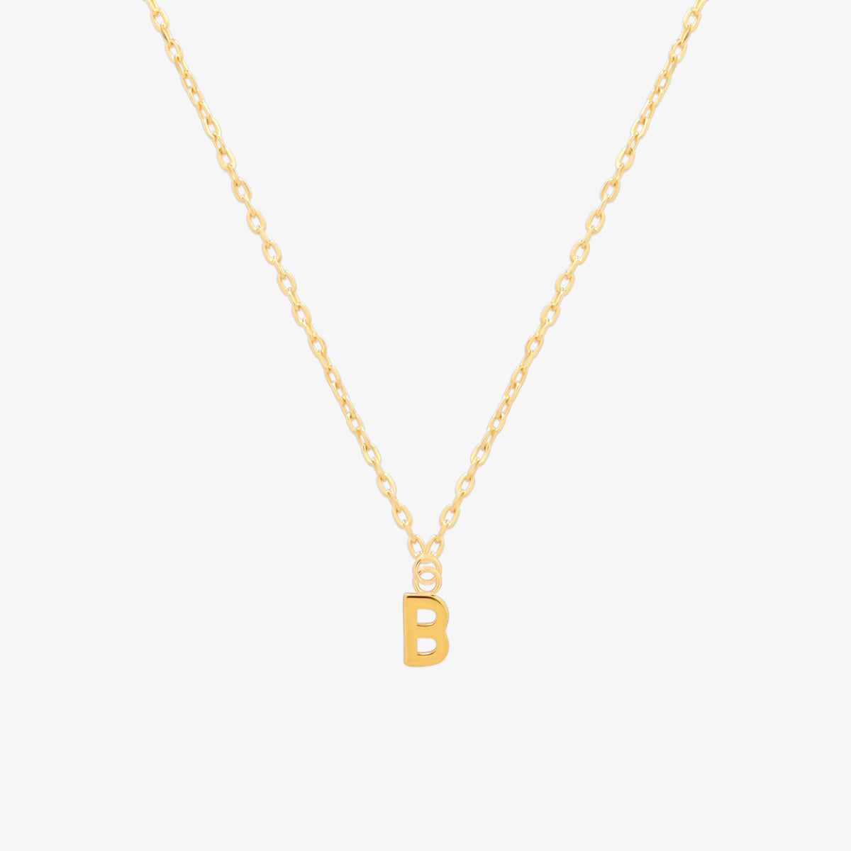 Classic initial pendant necklace featuring a polished letter charm on a delicate chain, showcasing a timeless and elegant design.