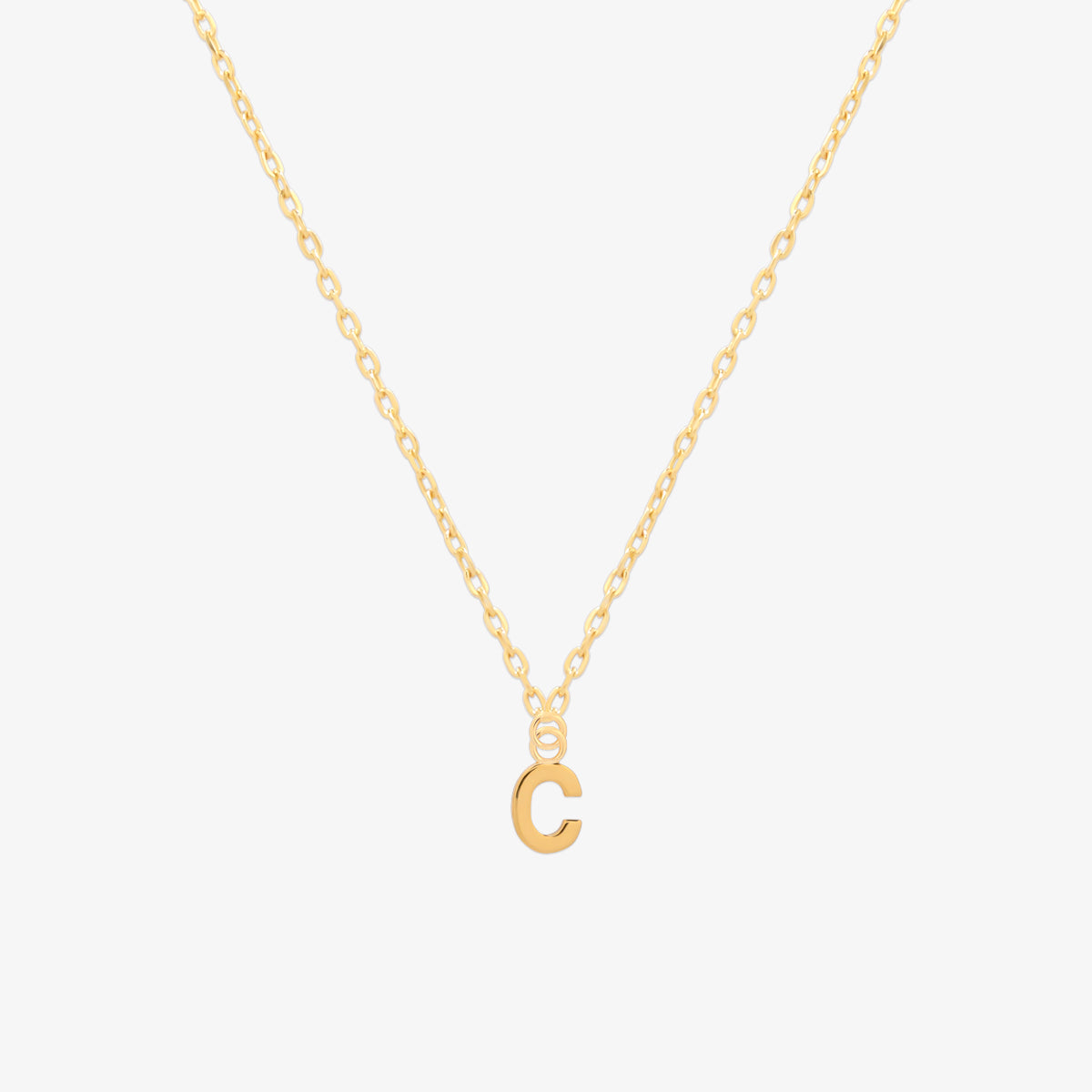 Classic initial pendant necklace featuring a polished letter charm on a delicate chain, showcasing a timeless and elegant design.