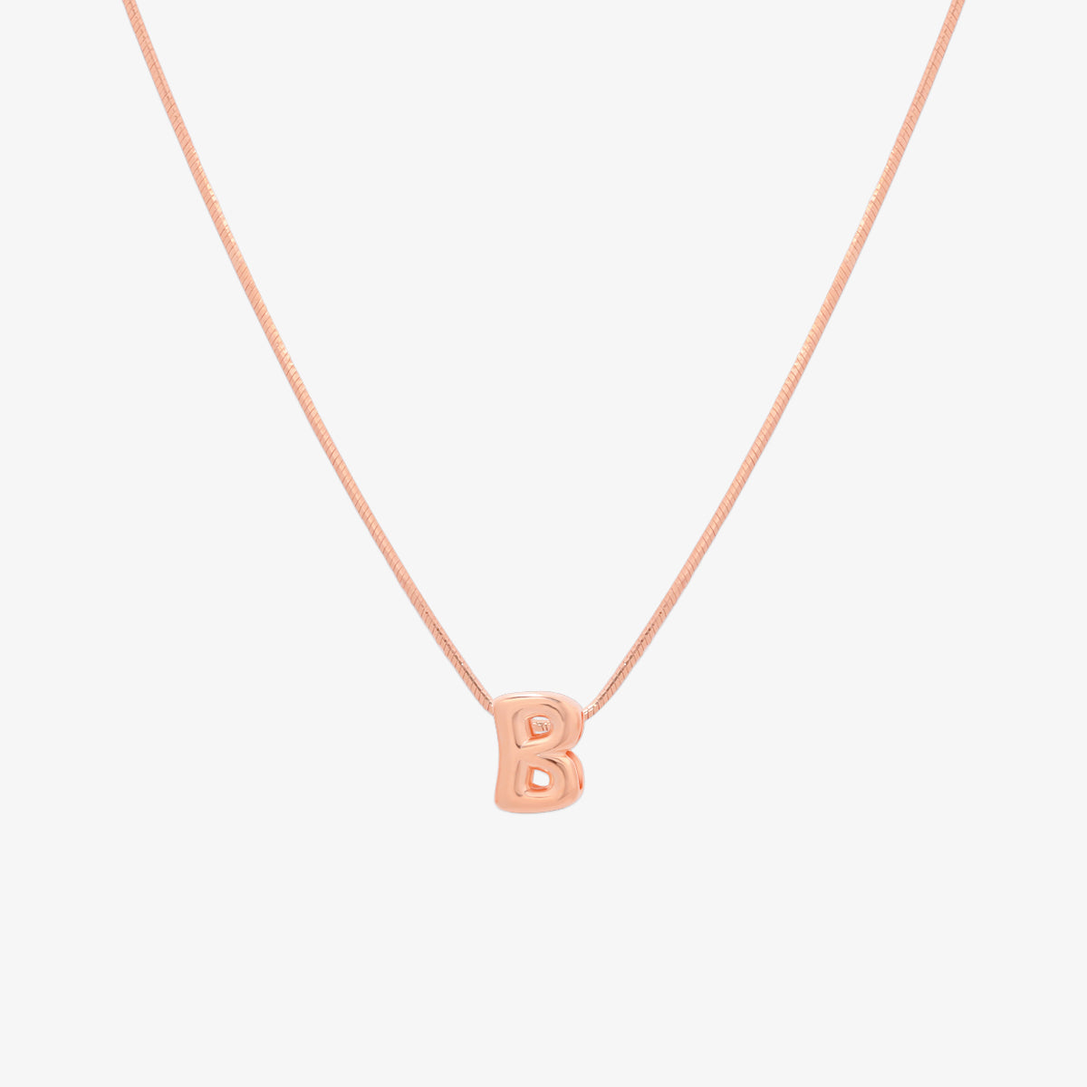 Bubble initial pendant necklace featuring a rounded, playful letter charm on a sleek snake chain, with a smooth and glossy finish.