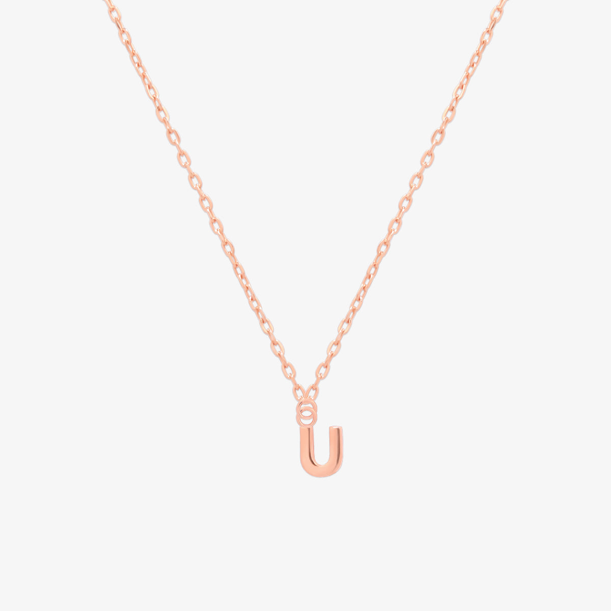 Classic initial pendant necklace featuring a polished letter charm on a delicate chain, showcasing a timeless and elegant design.