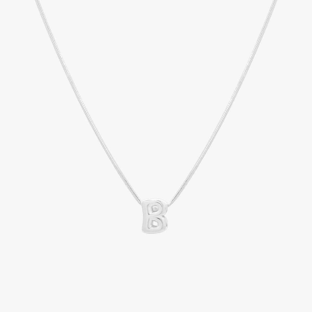 Bubble initial pendant necklace featuring a rounded, playful letter charm on a sleek snake chain, with a smooth and glossy finish.