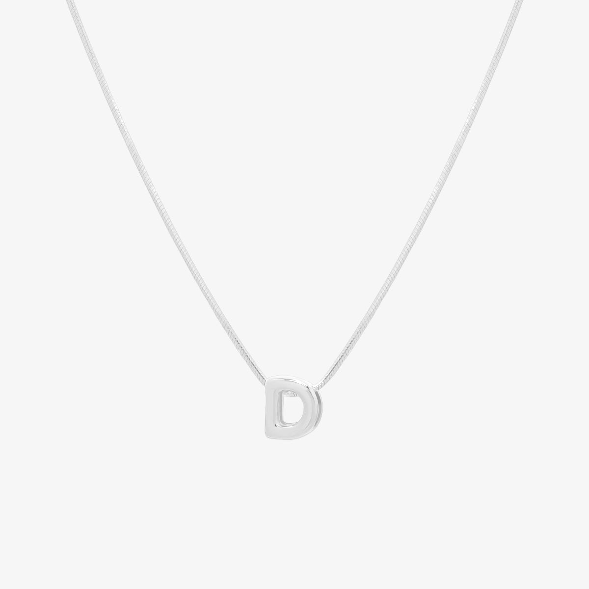 Bubble initial pendant necklace featuring a rounded, playful letter charm on a sleek snake chain, with a smooth and glossy finish.