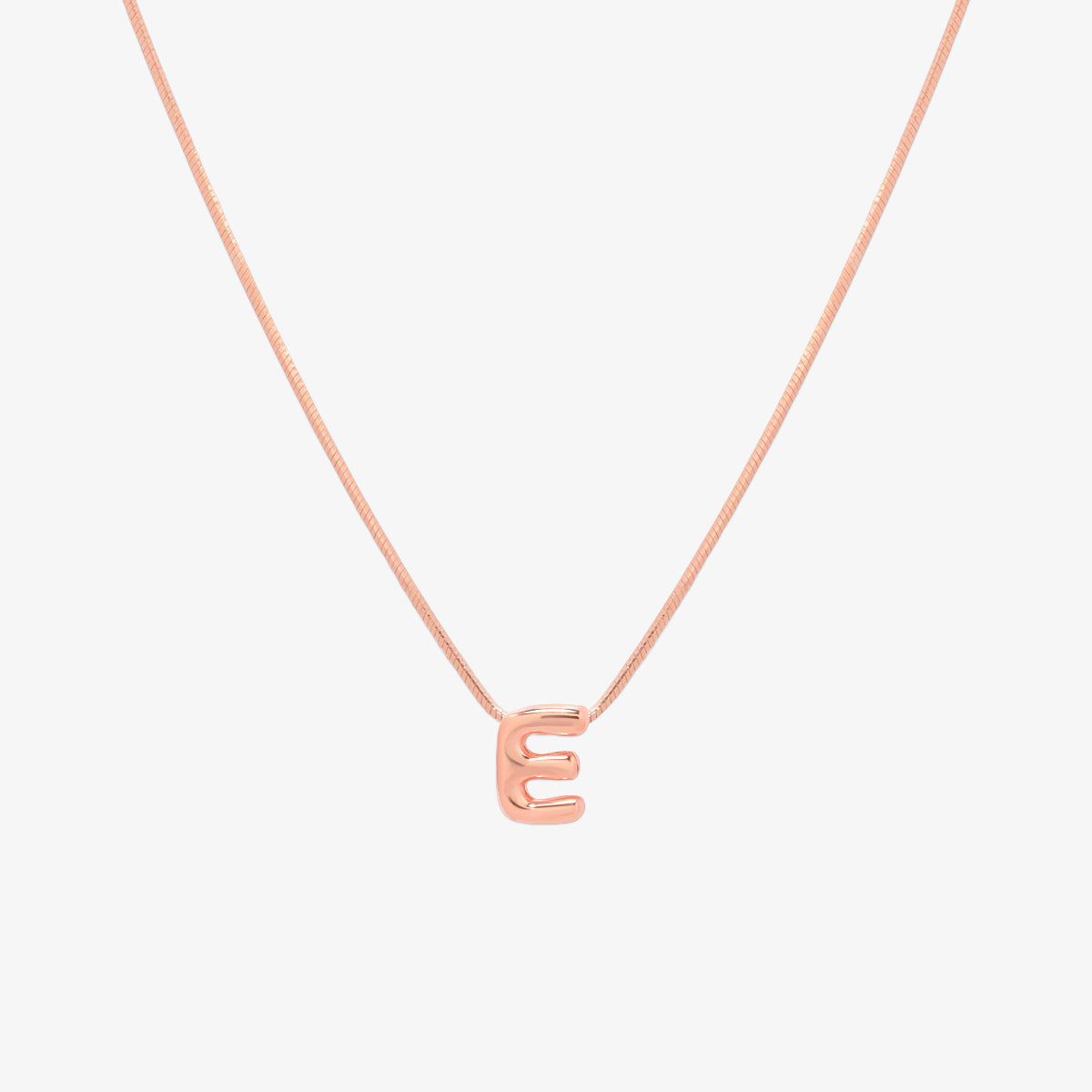 Bubble initial pendant necklace featuring a rounded, playful letter charm on a sleek snake chain, with a smooth and glossy finish.