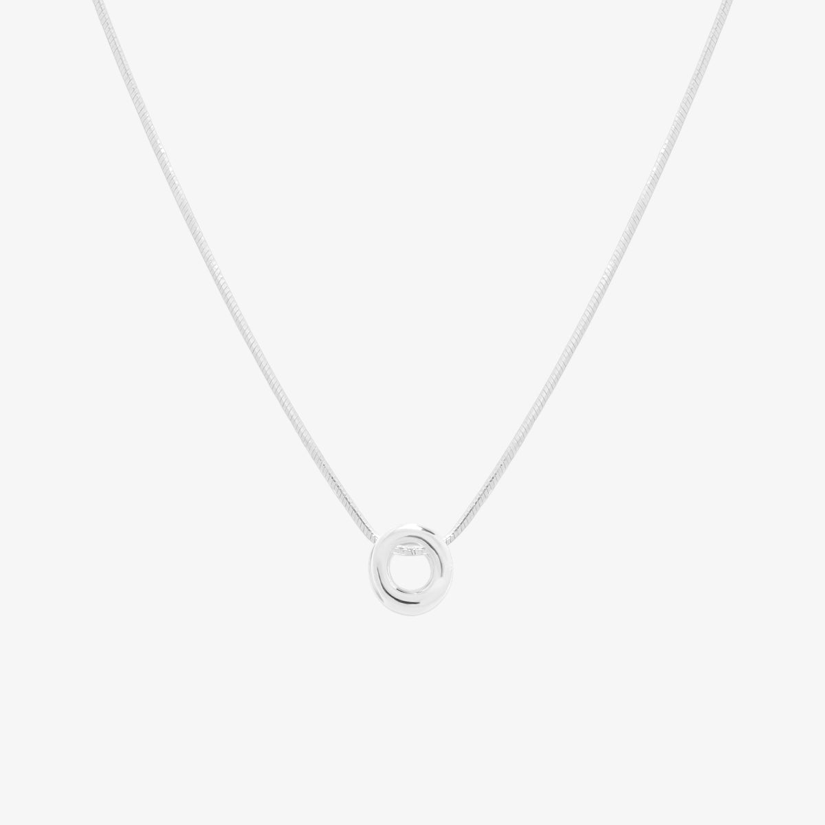 Bubble initial pendant necklace featuring a rounded, playful letter charm on a sleek snake chain, with a smooth and glossy finish.