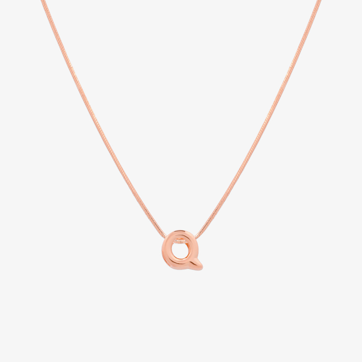 Bubble initial pendant necklace featuring a rounded, playful letter charm on a sleek snake chain, with a smooth and glossy finish.