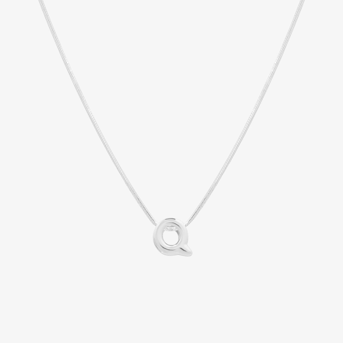 Bubble initial pendant necklace featuring a rounded, playful letter charm on a sleek snake chain, with a smooth and glossy finish.