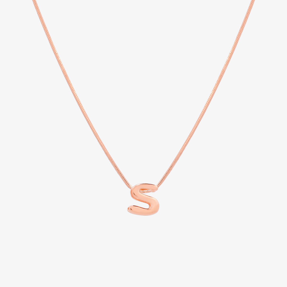 Bubble initial pendant necklace featuring a rounded, playful letter charm on a sleek snake chain, with a smooth and glossy finish.