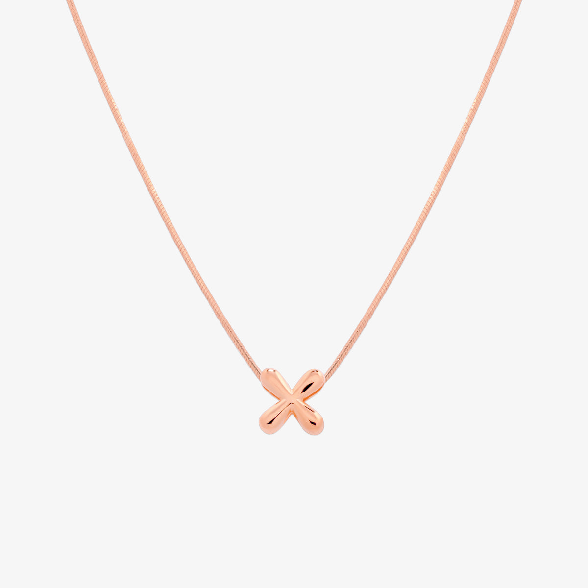 Bubble initial pendant necklace featuring a rounded, playful letter charm on a sleek snake chain, with a smooth and glossy finish.