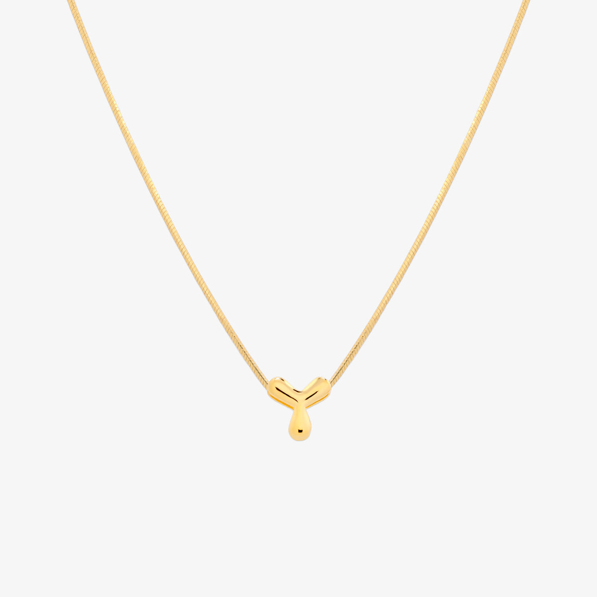 Bubble initial pendant necklace featuring a rounded, playful letter charm on a sleek snake chain, with a smooth and glossy finish.