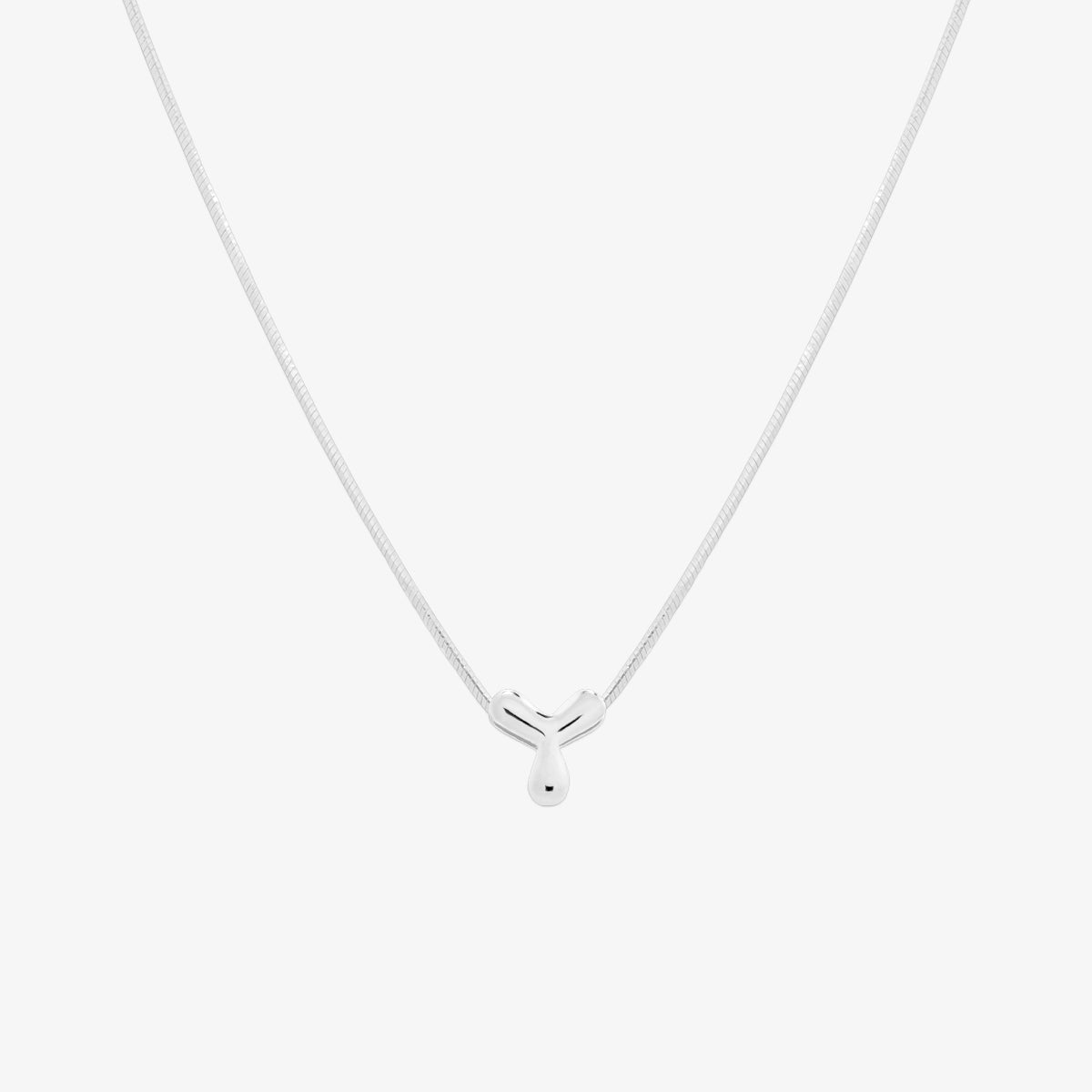 Bubble initial pendant necklace featuring a rounded, playful letter charm on a sleek snake chain, with a smooth and glossy finish.