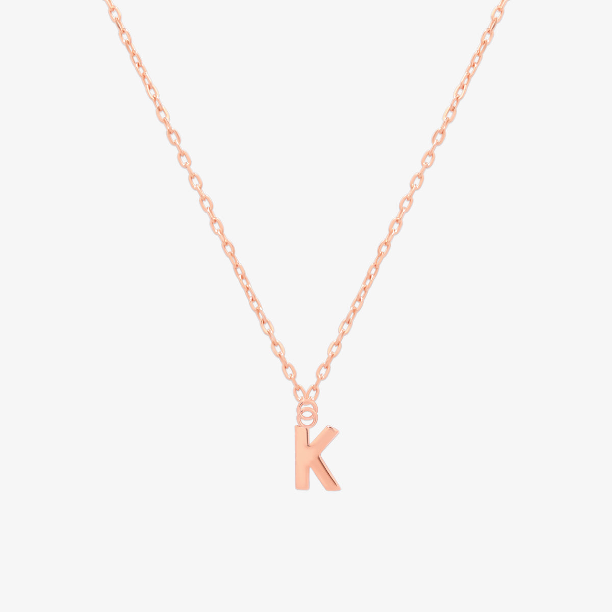 Classic initial pendant necklace featuring a polished letter charm on a delicate chain, showcasing a timeless and elegant design.