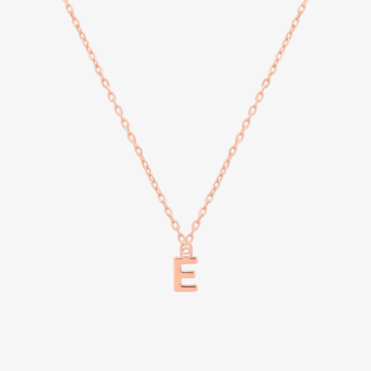 Classic initial pendant necklace featuring a polished letter charm on a delicate chain, showcasing a timeless and elegant design.