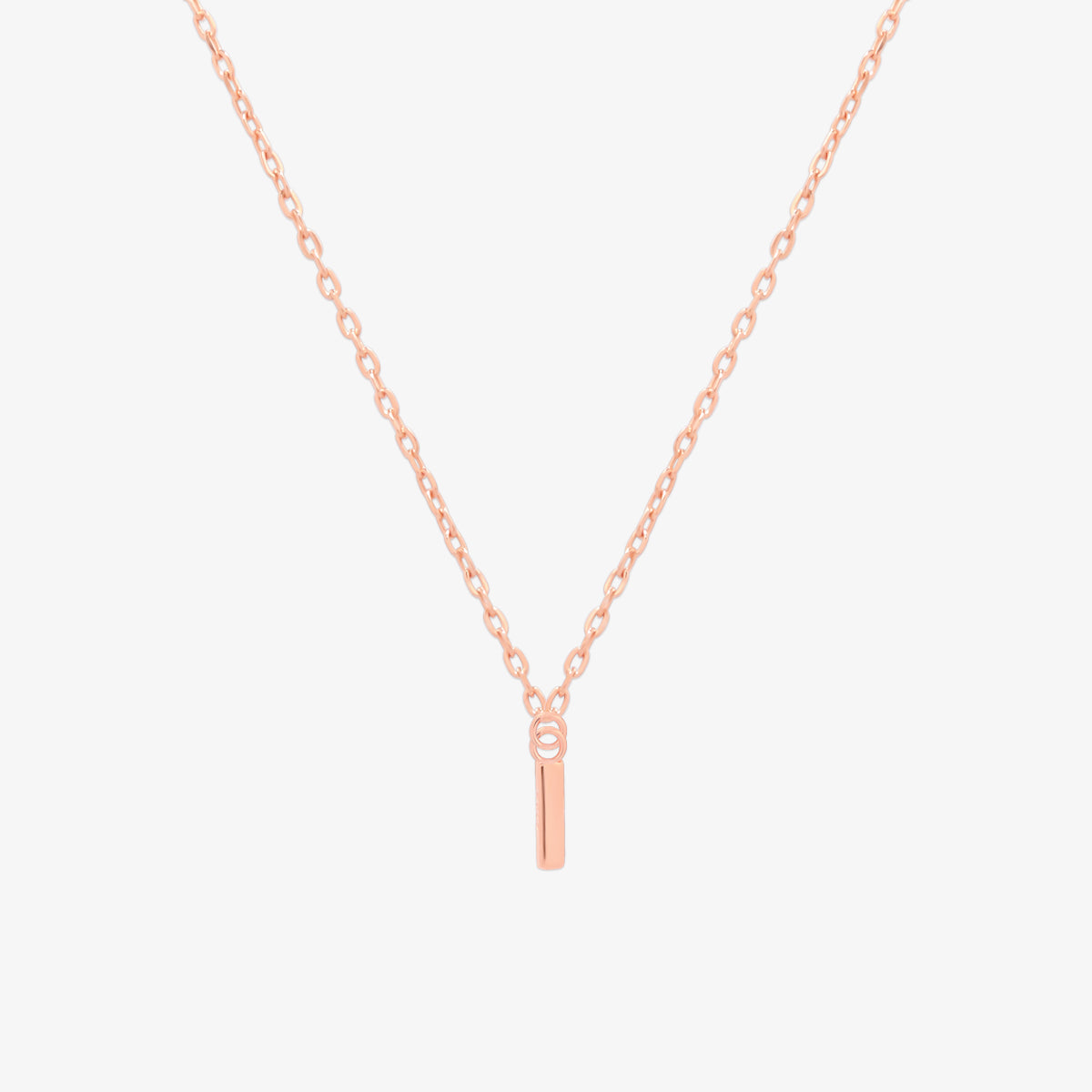 Classic initial pendant necklace featuring a polished letter charm on a delicate chain, showcasing a timeless and elegant design.