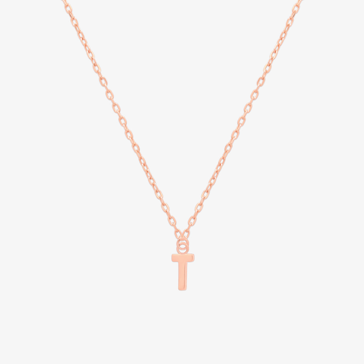 Classic initial pendant necklace featuring a polished letter charm on a delicate chain, showcasing a timeless and elegant design.