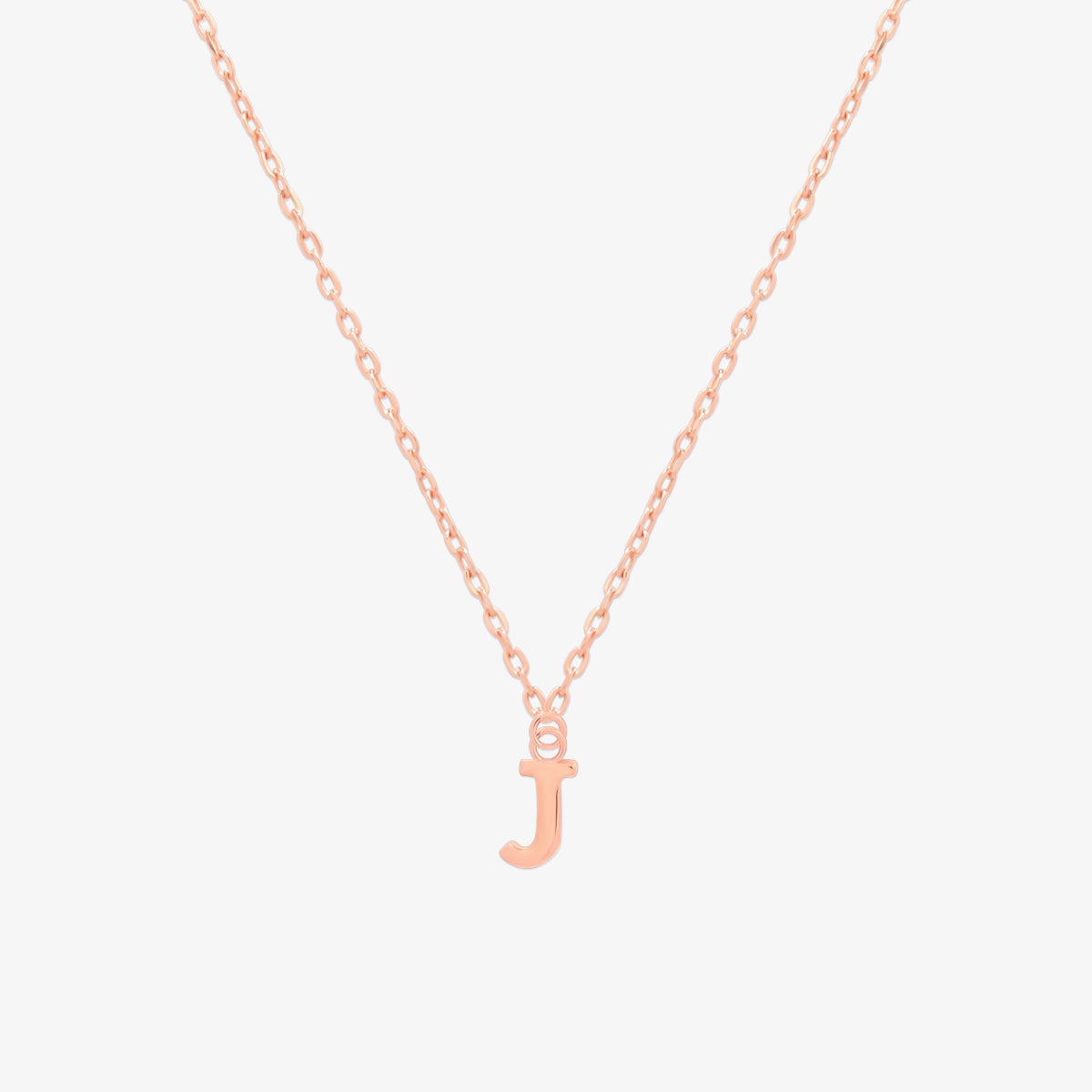 Classic initial pendant necklace featuring a polished letter charm on a delicate chain, showcasing a timeless and elegant design.