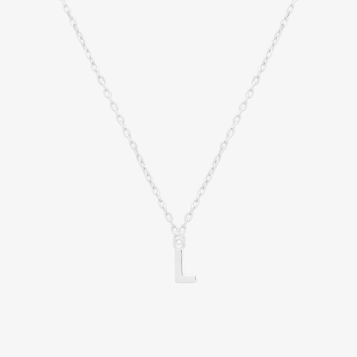 Classic initial pendant necklace featuring a polished letter charm on a delicate chain, showcasing a timeless and elegant design.