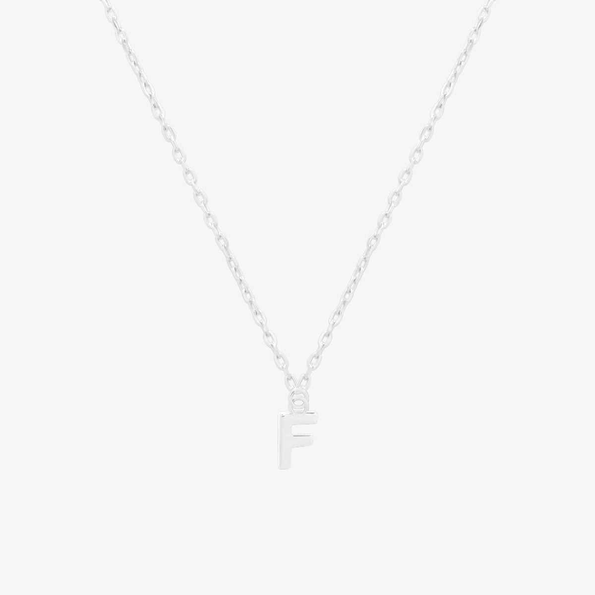 Classic initial pendant necklace featuring a polished letter charm on a delicate chain, showcasing a timeless and elegant design.